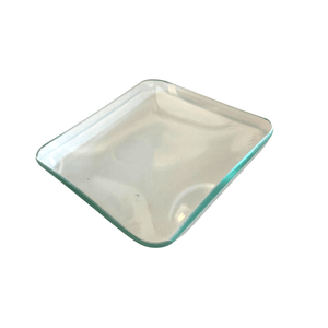 A square clear glass soap dish with a slightly beveled edge.