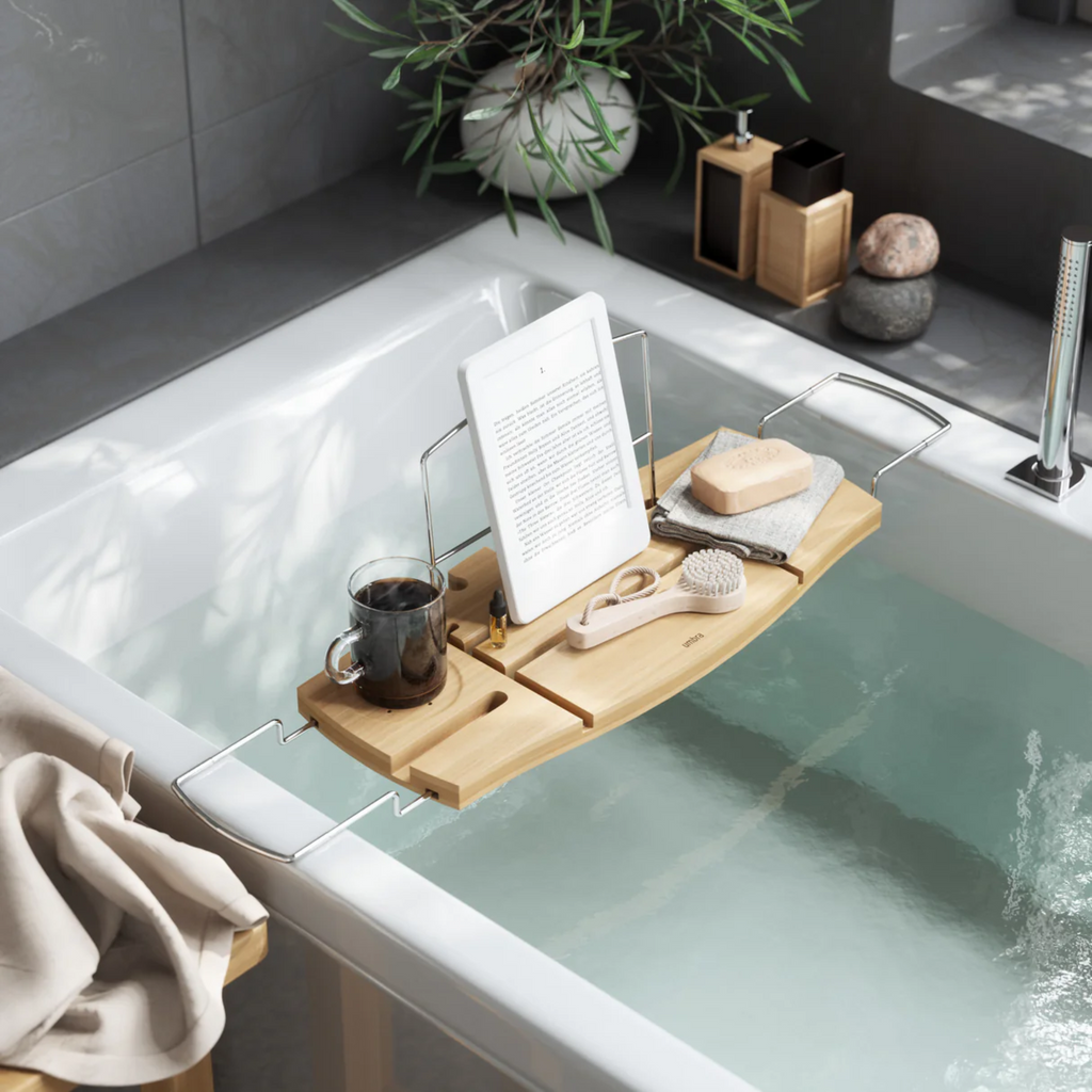 Umbra Aquala bath caddy set up in a serene bathroom