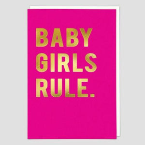 Bright pink rectangular card that writes "Baby Girls Rule." in large gold capitalized letters