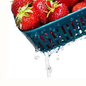strawberries inside the blue interior colander of the prep and go with colander container