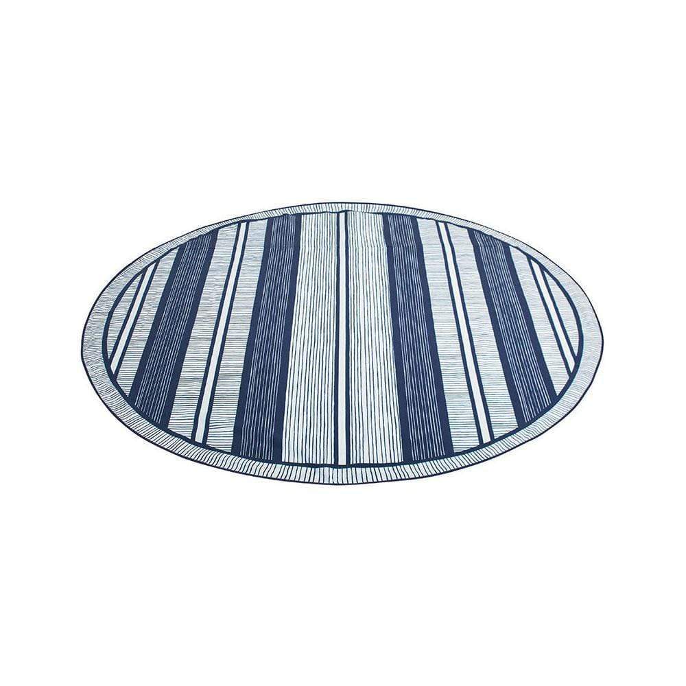 Basil Bangs round beach blanket, in Atlantic pattern with blue and white stripes lying flat on a white background, viewed on an angle with stripes running vertically.