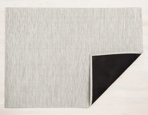 A rectangular woven floor mat made of an eco friendly vinyl yarn in pale grey