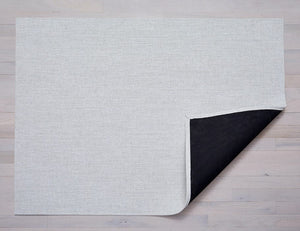 a rectangular woven floor mat made of eco friendly vinyl yarn in warm white, like the colour of a marshallow