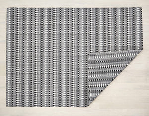 a heddle style woven floor mat made of eco friendly vinyl yarn in white, black, and various shades of grey