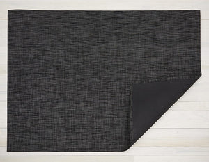 a rectangular woven floor mat made of eco friendly vinyl yarn in deep grey