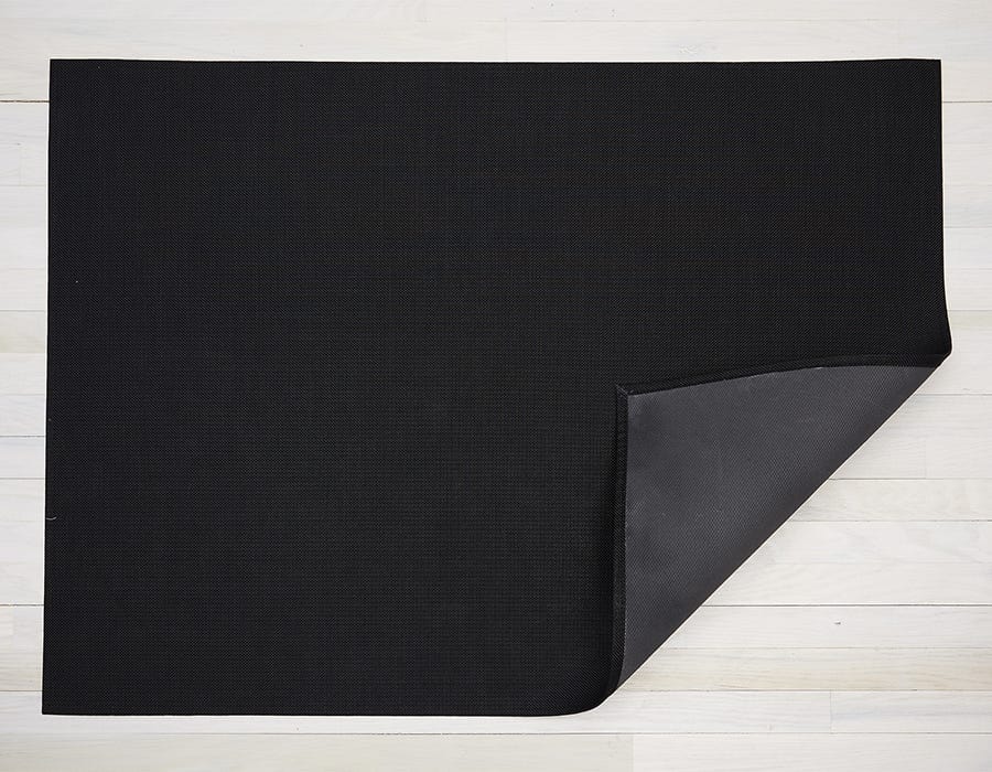a rectangular floor mat made of eco friendly vinyl in soft black
