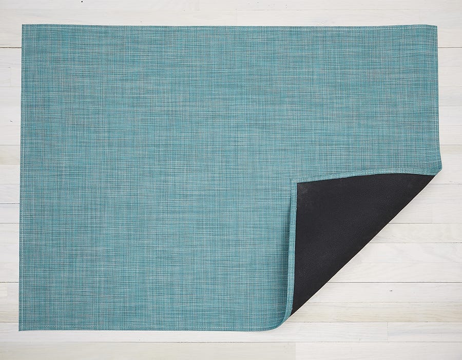 a tightly woven rectangular floor mat in turquoise made of eco friendly vinyl