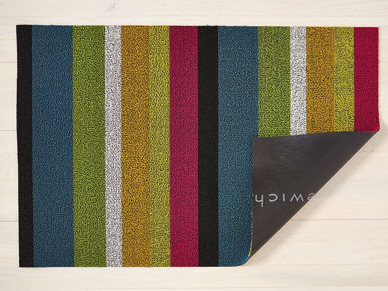 a rectangular, bright, multi colour shag floor mat made of eco friendly looped vinyl yarns backed with commercial black rubber