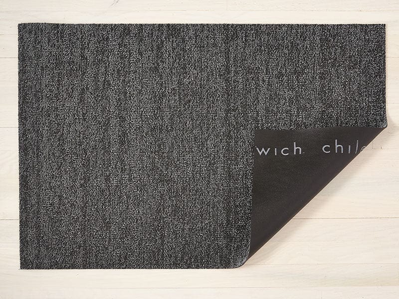 a heathered grey rectangular floor mat made of eco friendly looped vinyl yarns backed with black commercial rubber