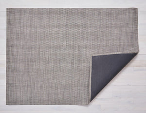 a light brown/grey coloured rectangular, woven floor made made of eco friendly vinyl, backed with black on slip material