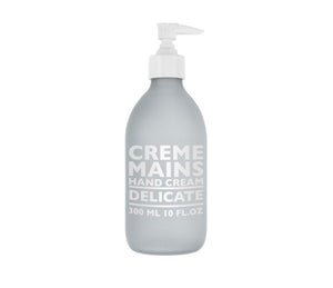 Compagnie de Provence Delicate hand cream, in a pale grey, frosted glass 300mL bottle with a pump