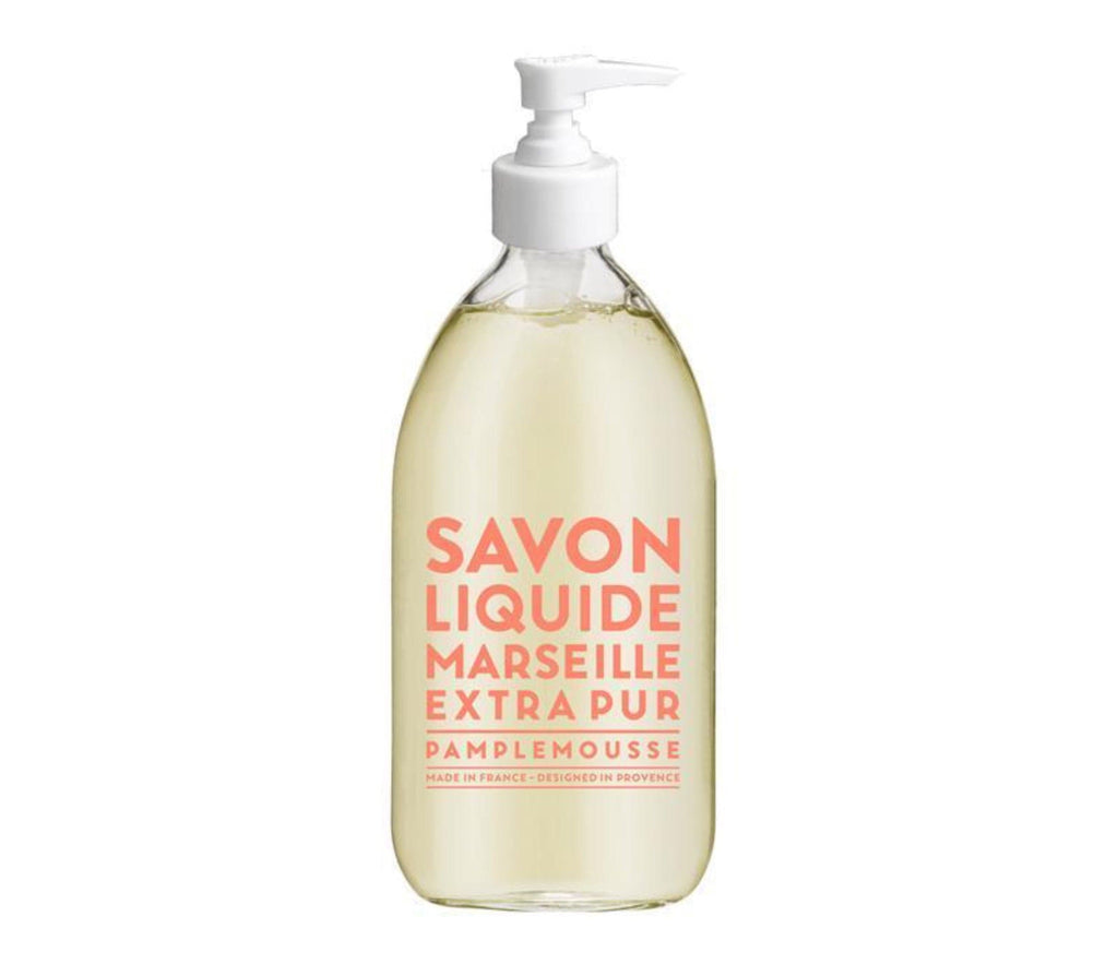 Compagnie de Provence Pink Grapefruit liquid soap in a 500mL clear glass bottle, with melon coloured bold lettering and a pump dispenser