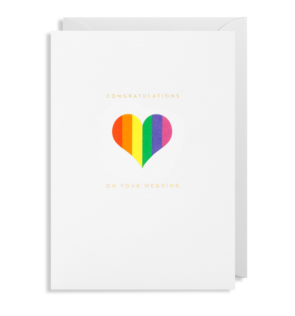 White card with pride rainbow hear that reads "congratuelations" in gold and underneath "on your wedding