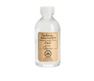A clear, plastic bottle of Milk scented diffuser refill liquid, with a beige label printed with the words "Rechard batons a parfum, fragrance diffuser refill, lait, milk ," the Lothantique logo and a danger flammable symbol