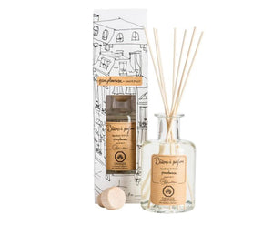 A clear, glass bottle of Grapefruit scented diffuser, with 7 bamboo reeds in the neck of the bottle and a lable printed with " Batons a parfum, fragrance diffuser, clementine" and the Lothantique logo. Shown with a second bottle in white packaging with black line drawings of French houses.
