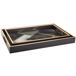 two rectangular art deco style trays in black with gold trim and a gold, black, and cream tile pattern