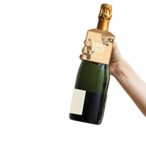 Champagne bottle with bottleneck gift tag attatched